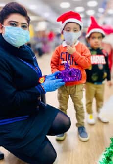 Posing with the youngest santas!